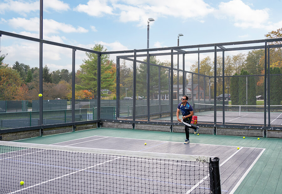 paddle tennis player in full swing