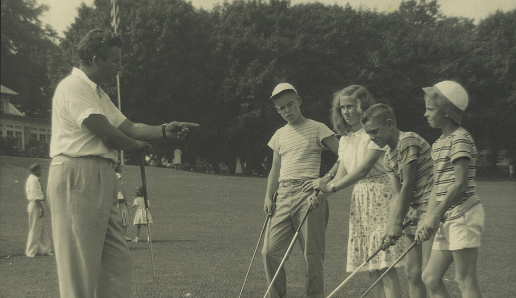 Youth getting golf instruction