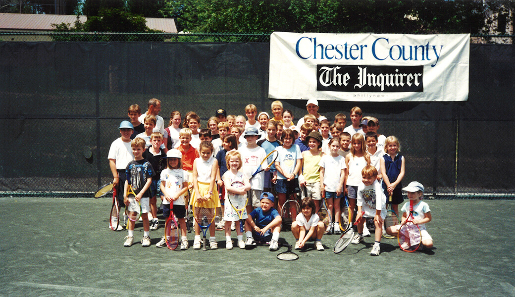 group photo in front of club banner