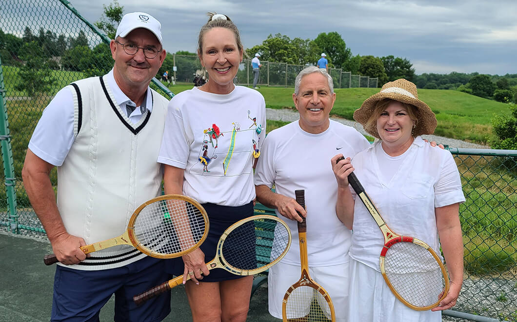 couples posing with tennis racquets