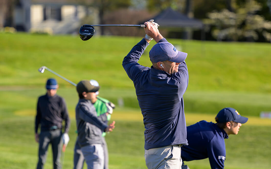 golfers at driving range